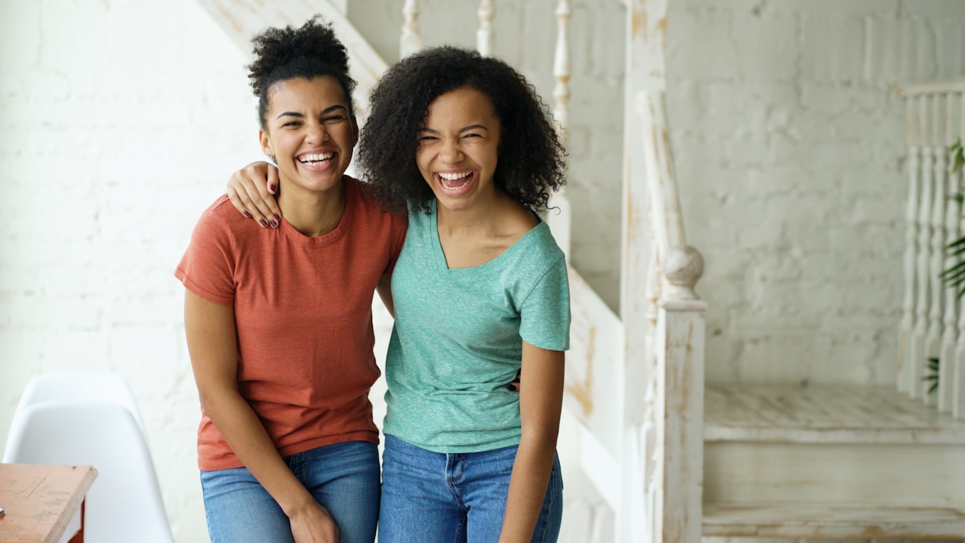 Two friends laughing together